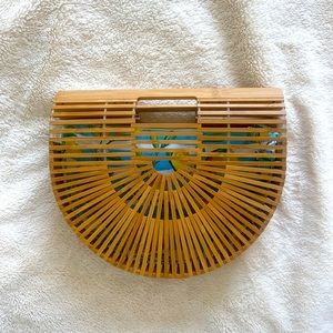 new clutch/purse. wood, lightweight and has a removable insert.